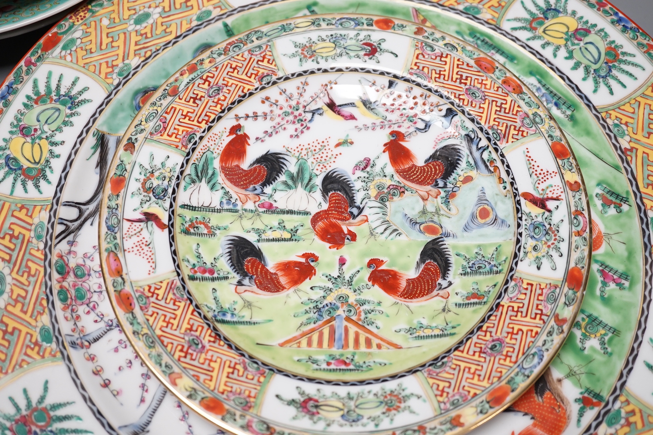 A group of 20th century Chinese enamelled porcelain plates dishes bowls and two jugs, Charger 38.5 cm